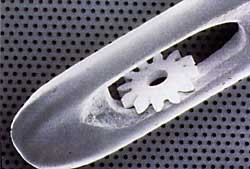 Electroformed nickel micro-gear in the eye of a needle